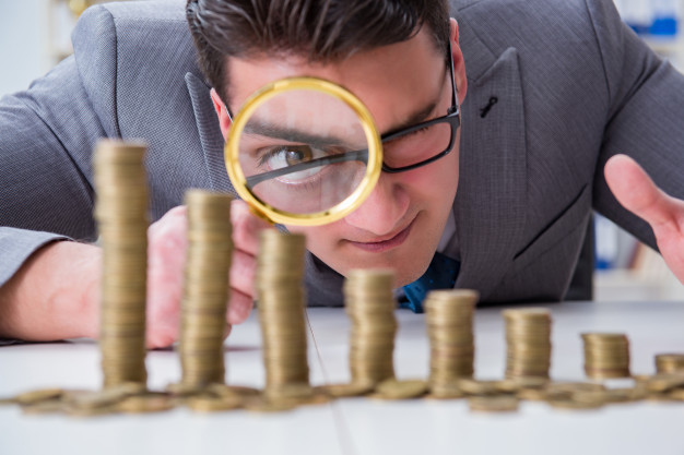 person looking at coins